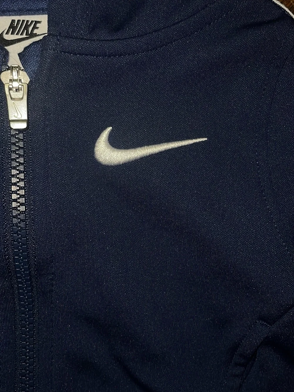 Nike Navy Zip Hoodie with White Swoosh Accent